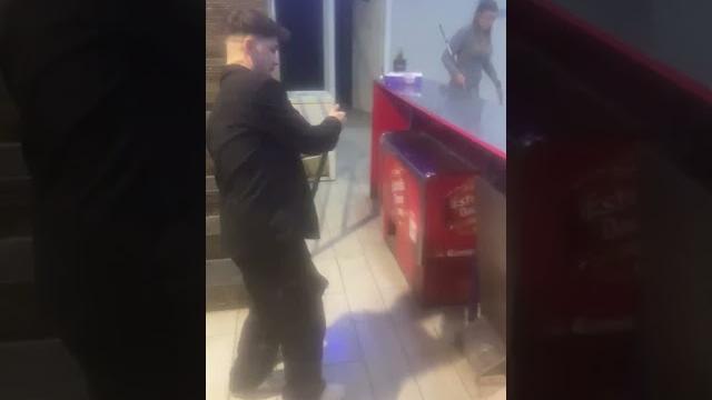 Young man slips while mopping and dancing Young man slips while mopping and dancing