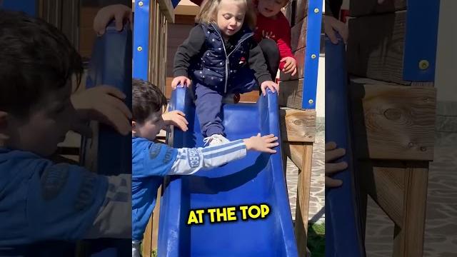 Siblings help their blind sister slide Siblings help their blind sister slide