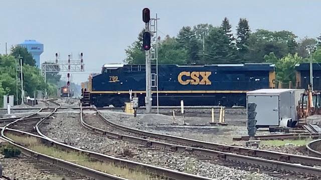 2 trains passing over fostoria rr diamonds, old locomotives roar over diamonds with steel coil train 2 trains passing over fostoria rr diamonds, old locomotives roar over diamonds with steel coil train