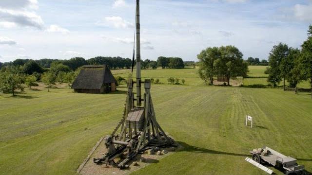 Unleashing a medieval trebuchet on a wooden palisade Unleashing a medieval trebuchet on a wooden palisade