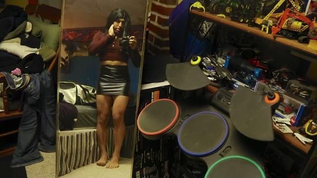 Crossdresser in tight, black latex mini skirt Crossdresser in tight, black latex mini skirt