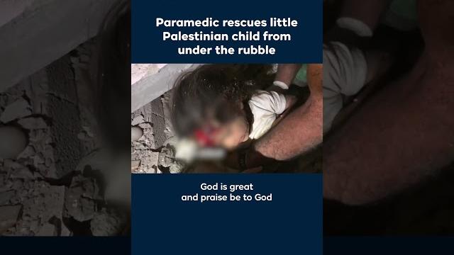 Paramedic rescues little palestinian child from under the rubble Paramedic rescues little palestinian child from under the rubble