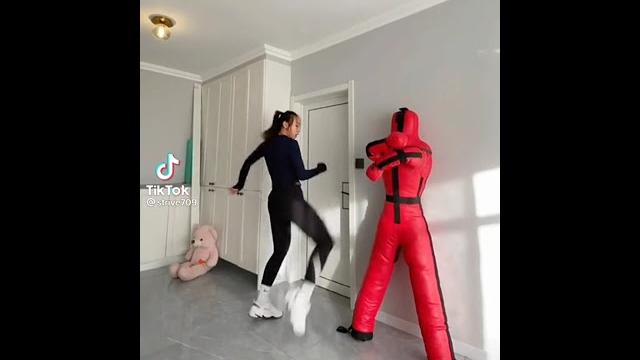 Chinese taekwondo girl kicks your groin Chinese taekwondo girl kicks your groin