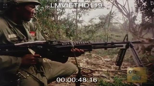 Black rambo in vietnam hip-firing m60 Black rambo in vietnam hip-firing m60
