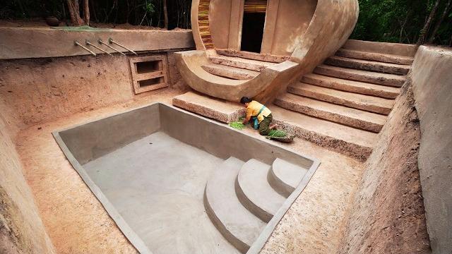 Building a private modern mud house and underground swimming pool for living long time in the woods Building a private modern mud house and underground swimming pool for living long time in the woods