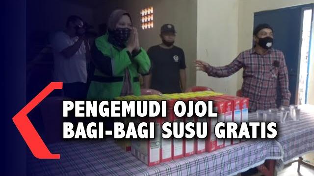 Pengemudi ojol bagi-bagi susu gratis Pengemudi ojol bagi-bagi susu gratis
