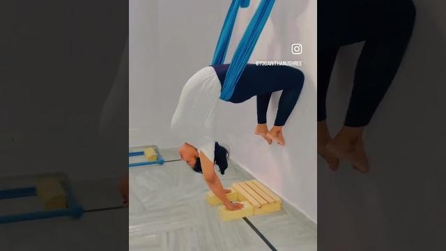 Upside down camel/bow pose with wall rope. Upside down camel/bow pose with wall rope.