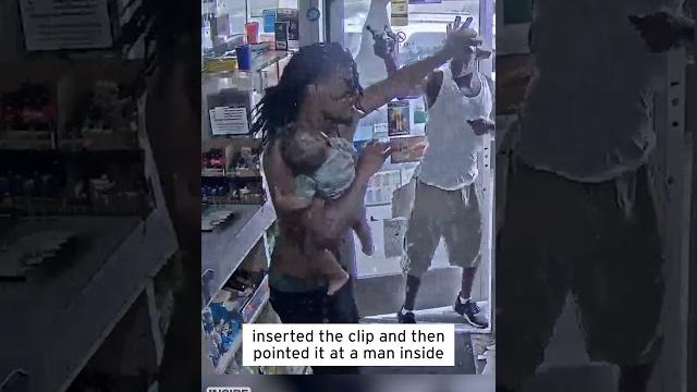 Dad holding baby fights off gunman #shorts Dad holding baby fights off gunman #shorts