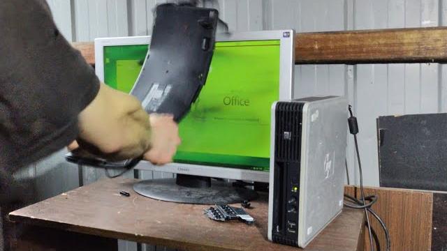 Angry office man smashes slow 2000's hp computer Angry office man smashes slow 2000's hp computer