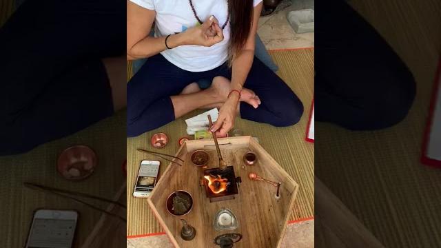 Performing agnihotra Performing agnihotra