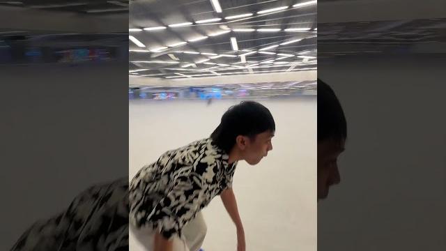 Young man slips while ice skating Young man slips while ice skating
