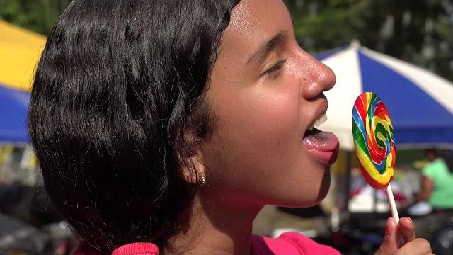 Teen girl lollipop carnival park happy summer Teen girl lollipop carnival park happy summer