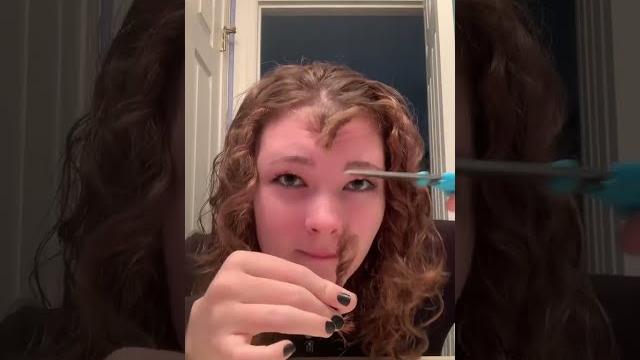 Woman accidentally cuts her bangs way too short! Woman accidentally cuts her bangs way too short!