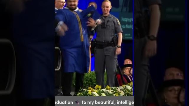 University at buffalo graduate chased on stage by police while holding infant son during ceremony University at buffalo graduate chased on stage by police while holding infant son during ceremony
