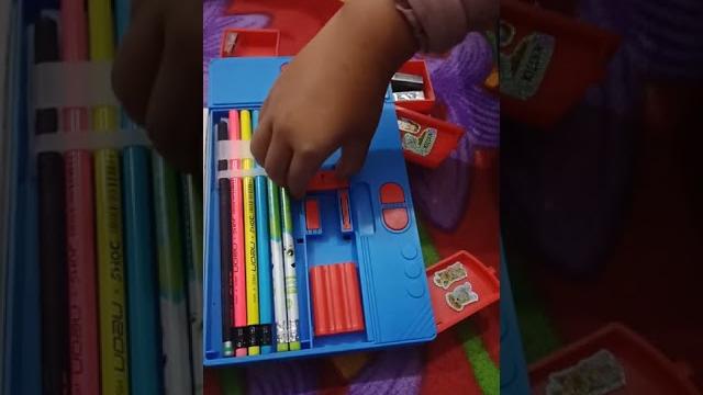 Button operated pencil box.... Button operated pencil box....