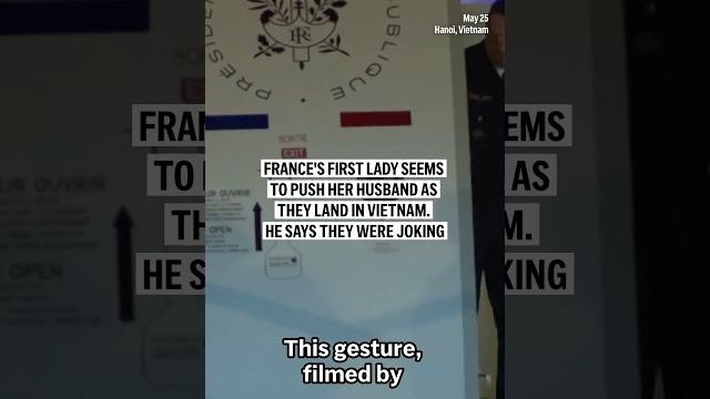 France's first lady seems to push her husband as they land in vietnam. he says they were joking France's first lady seems to push her husband as they land in vietnam. he says they were joking