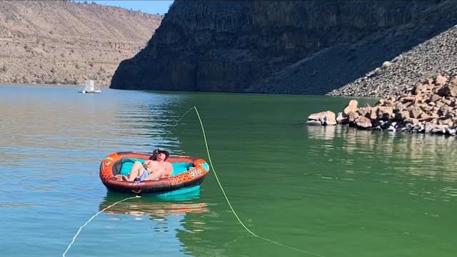 Fly fishing big lake trout// on giant inner tube #shorts Fly fishing big lake trout// on giant inner tube #shorts