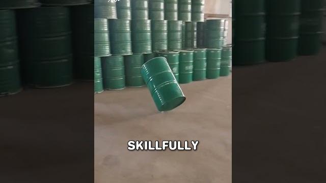 Watch how this worker moves heavy drums like a pro Watch how this worker moves heavy drums like a pro