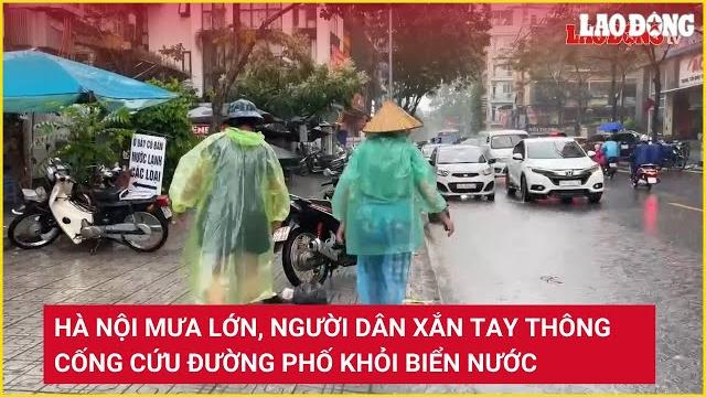 Hà nội mưa lớn, người dân xắn tay thông cống cứu đường phố khỏi biển nước | báo lao động Hà nội mưa lớn, người dân xắn tay thông cống cứu đường phố khỏi biển nước | báo lao động