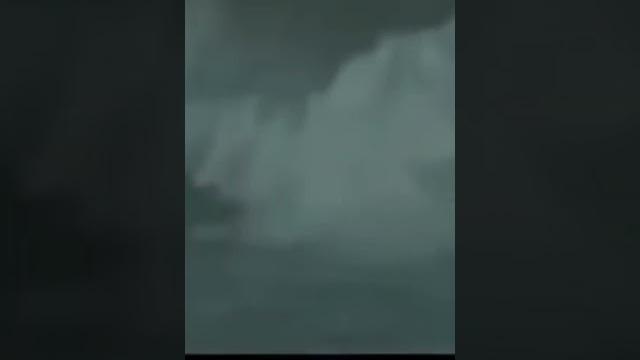 Man surfing a hurricane wave Man surfing a hurricane wave