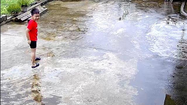 Rainy day adventure takes a comical turn as young boy slips and falls twice in a row || wooglobe Rainy day adventure takes a comical turn as young boy slips and falls twice in a row || wooglobe
