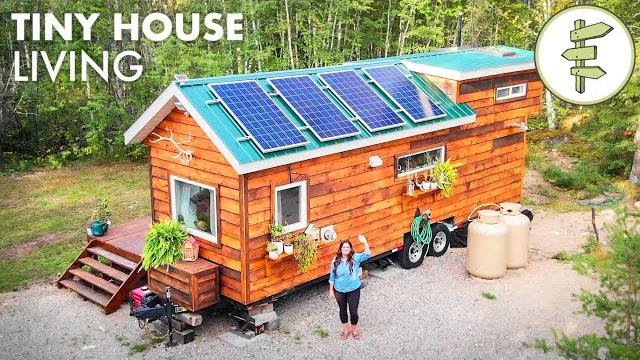 Woman living off-grid in her tiny house in northern canada Woman living off-grid in her tiny house in northern canada