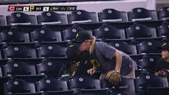 Daughter kisses dad after he catches ball Daughter kisses dad after he catches ball