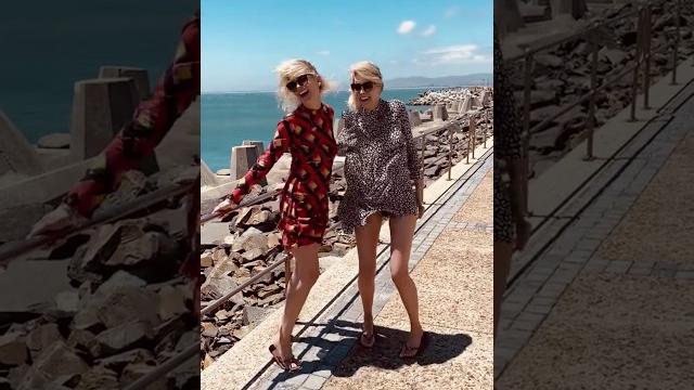 Windblown blonde twins at the beach Windblown blonde twins at the beach