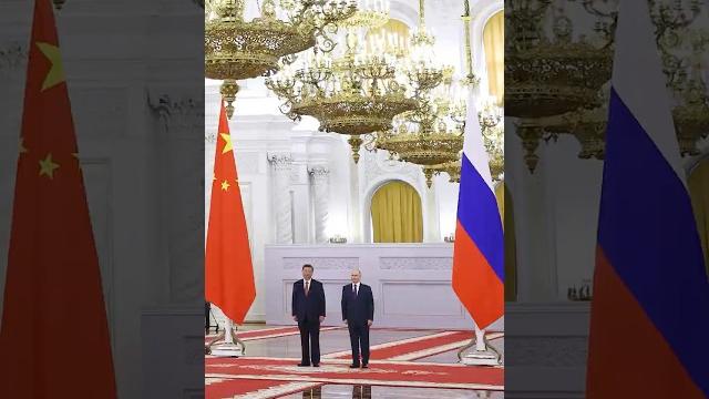 Putin welcomes china's xi to kremlin for state visit Putin welcomes china's xi to kremlin for state visit