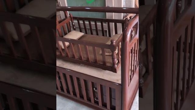 This baby cot with built-in drawers & wheeled storage makes organizing so easy say goodbye to cluter This baby cot with built-in drawers & wheeled storage makes organizing so easy say goodbye to cluter