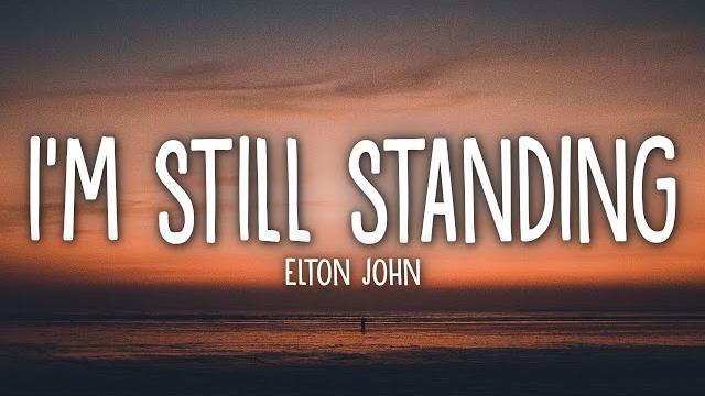 Elton john - i'm still standing (lyrics) Elton john - i'm still standing (lyrics)