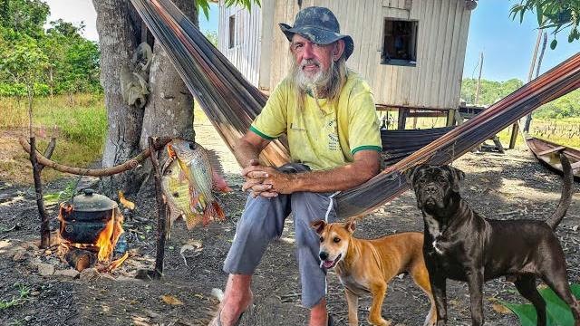 Isolated in the jungle without power, living with animals in his house, alone in the amazon forest Isolated in the jungle without power, living with animals in his house, alone in the amazon forest