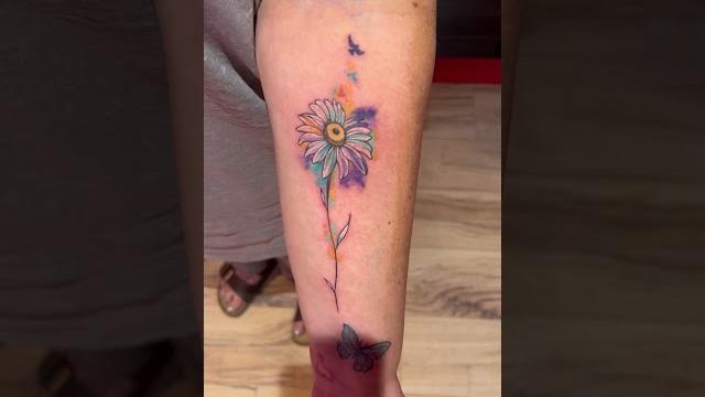 Pretty watercolour daisy tattoo Pretty watercolour daisy tattoo