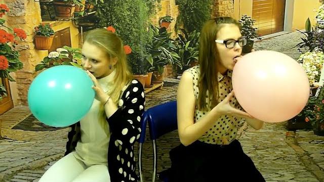 Two girls b2p some balloons Two girls b2p some balloons