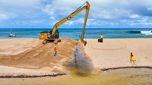 Massive excavator destroys hawaiian beach Massive excavator destroys hawaiian beach