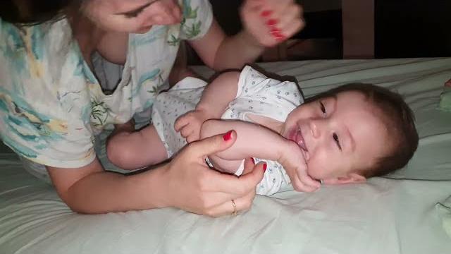Cute mommy and lovely baby playing and laughing Cute mommy and lovely baby playing and laughing