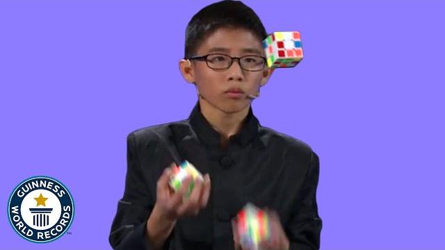 He juggled and solved 3 rubik's cubes! - guinness world records He juggled and solved 3 rubik's cubes! - guinness world records