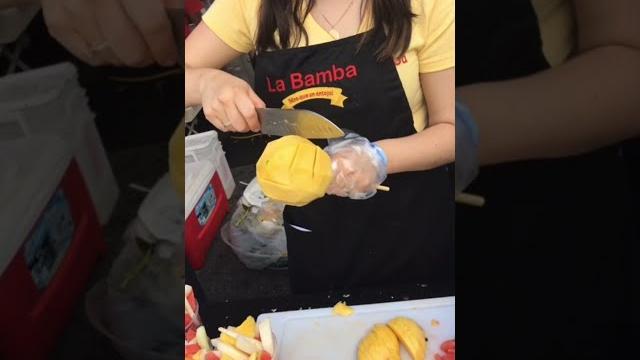 New york city street food - mango flower with chili |how to cut a mango into rose flower #shorts New york city street food - mango flower with chili |how to cut a mango into rose flower #shorts