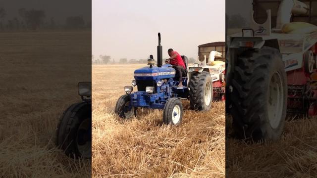 Farmtrac 70 with straw reaper Farmtrac 70 with straw reaper