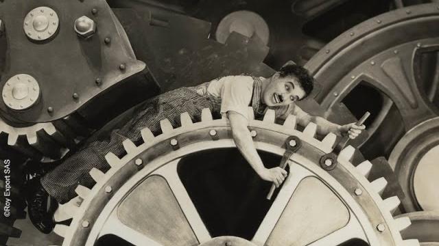 Charlie chaplin swallowed by a factory machine - modern times (1936) Charlie chaplin swallowed by a factory machine - modern times (1936)