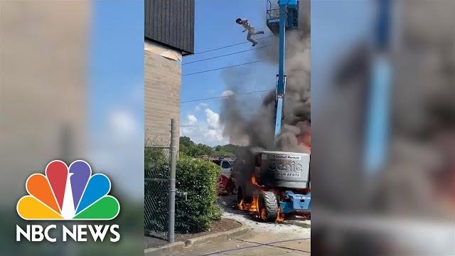 Watch: man jumps from burning cherry picker Watch: man jumps from burning cherry picker