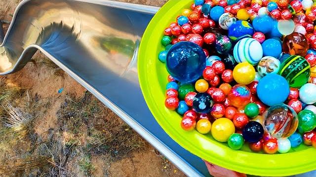 1000 marbles in a super slide marble run vs water balloons 1000 marbles in a super slide marble run vs water balloons
