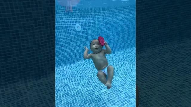 Cute baby swimming in pool Cute baby swimming in pool
