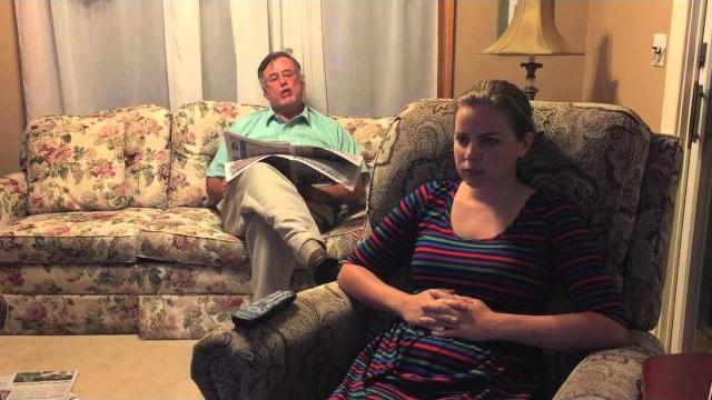 Dad and daughter sit in den Dad and daughter sit in den