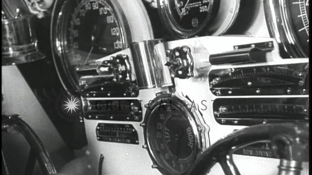 Men at the controls and looking through the periscope aboard a submarine underway...hd stock footage Men at the controls and looking through the periscope aboard a submarine underway...hd stock footage
