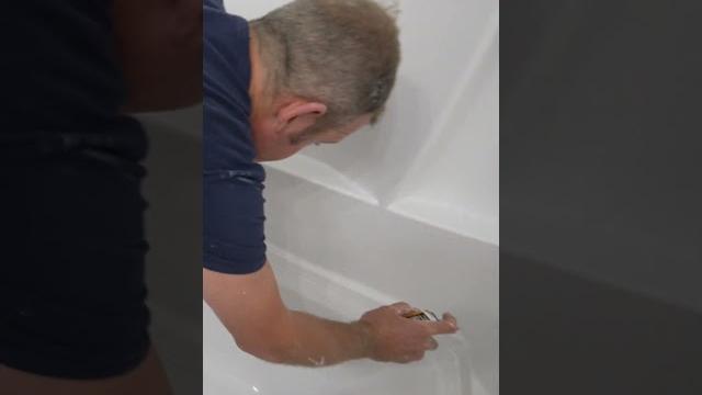 Caulking a tub Caulking a tub
