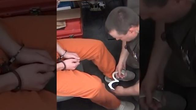 Young inmate secured in leg irons Young inmate secured in leg irons