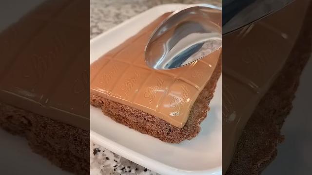 Chocolate cake with a whole block of chocolate on top Chocolate cake with a whole block of chocolate on top