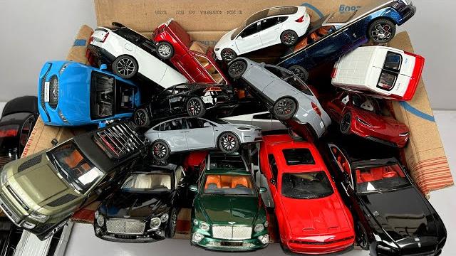Unboxing a box full of american & british diecast model cars - ford, rolls royce, tesla, range rover Unboxing a box full of american & british diecast model cars - ford, rolls royce, tesla, range rover