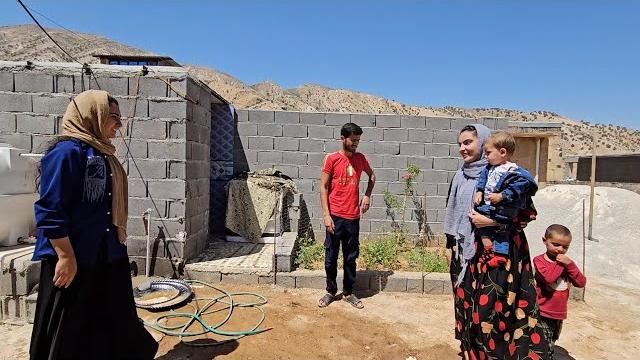 The channel's translator meets with afshin and shokofeh; building the kitchen with the tiler present The channel's translator meets with afshin and shokofeh; building the kitchen with the tiler present